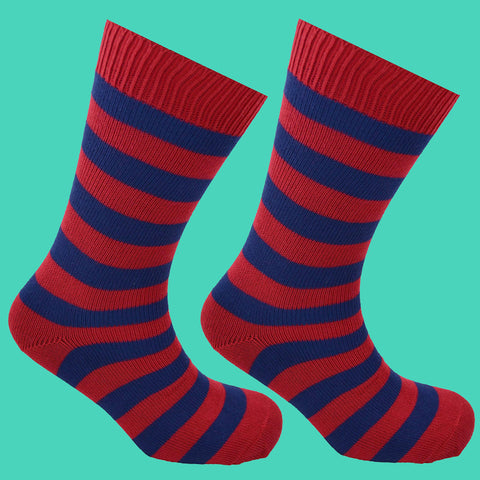 Red and Blue Striped Socks Blue Background
