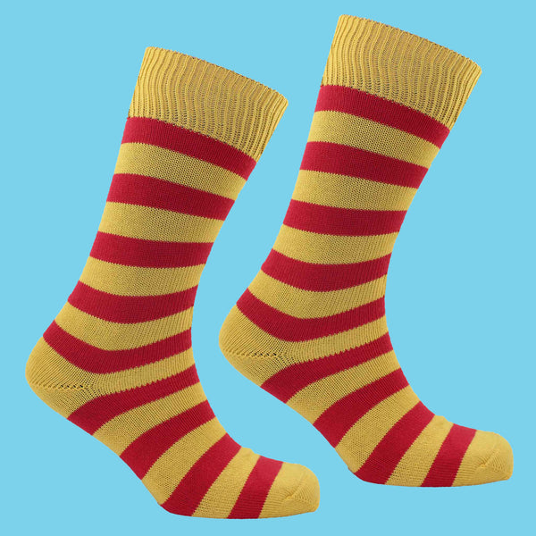 Yellow and Red Striped Socks Pale Blue Background
