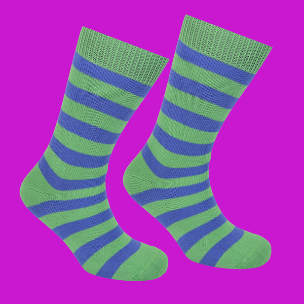 Green and Blue Striped Socks Pink Background